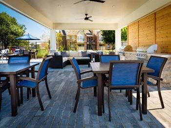 A patio with a table and chairs is shown.